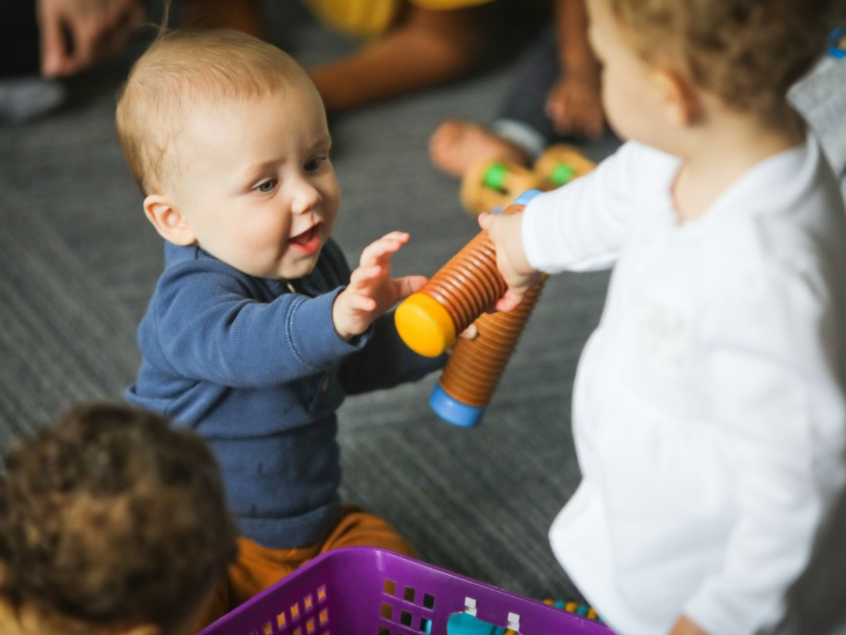 Babies sharing instrument